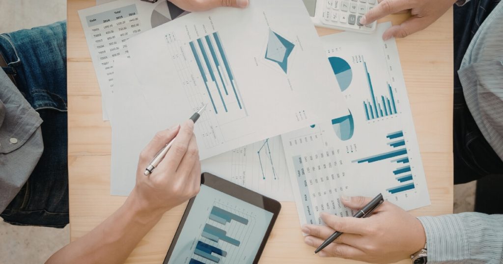 Cash-pay medical practice owner reviewing revenue growth chart