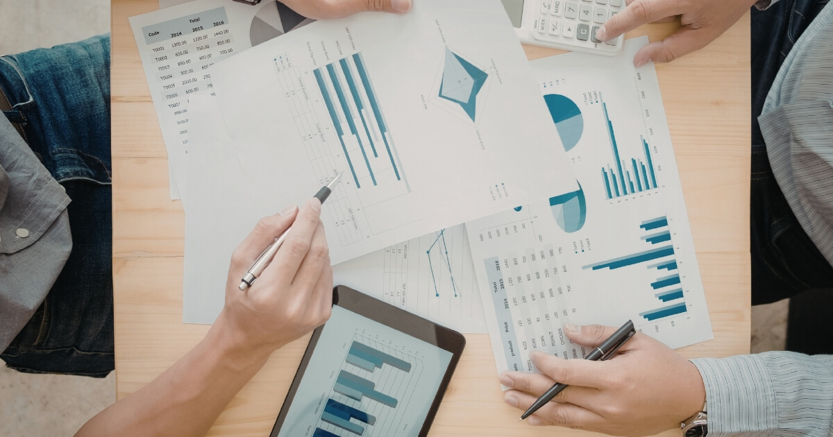Cash-pay medical practice owner reviewing revenue growth chart
